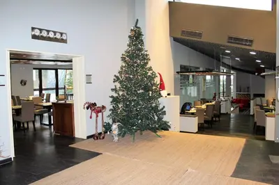a christmas tree in the middle of a restaurant at Private Studio Pine Whisper 4 pax in Euphoria Club in Borovets