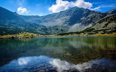 a large body of water with mountains in the background at Private Studio Pine Whisper 4 pax in Euphoria Club in Borovets