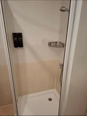 a shower with a glass door in a bathroom at Cozy studio 125 in Villa Park in Borovets