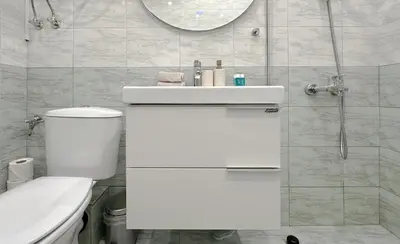 a bathroom with a white toilet and a sink at Sunny Sofia Studio with Balcony by Flat Mаnager in Sofia