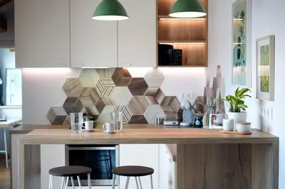 a kitchen with a wooden counter with stools at Modern Loft with Balcony in the heart of Sofia in Sofia