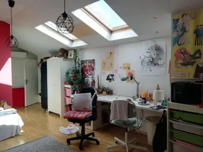 an office with a desk and two chairs in a room at Artsy Penthouse & mountain view in Sofia