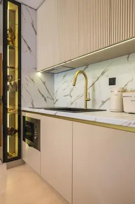 a kitchen with white cabinets and a sink at Einik Luxury Apartments in Velingrad