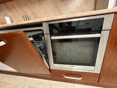 a microwave oven sitting inside of a kitchen at Apartament Avangard in Pazardzhik