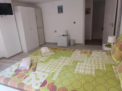 a room with a large bed with towels on it at Wendy House - Central Sofia - 3BRDR - Private Courtyard - 5 min to Vitosha blvd in Sofia