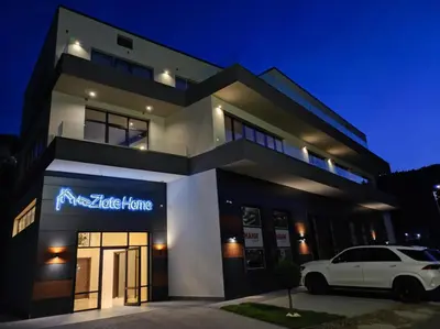 a white car parked in front of a house at Zlate Home in Zlatograd