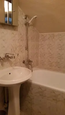a bathroom with a sink and a tub and a toilet at Boeritza Hotel Complex in Vladaya