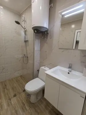 a bathroom with a white toilet and a sink at 20th Residence Studio 1 in Sofia