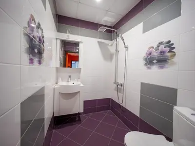 a bathroom with a toilet and a sink at The Boulevard Luxury Apartment 3 in Sofia