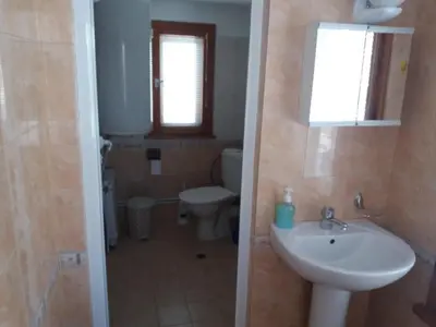 a bathroom with a sink and a toilet at Guest House AHP in Mala Tsŭrkva