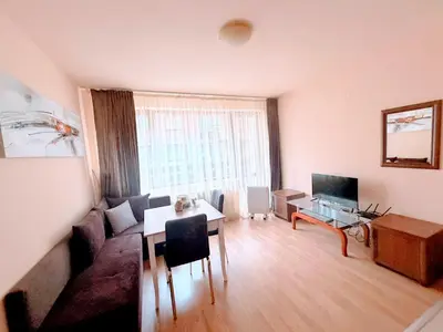 a living room with a couch and a table at Cozy One Bedroom Apartment in Bansko Near Gondola with Wi Fi in Bansko