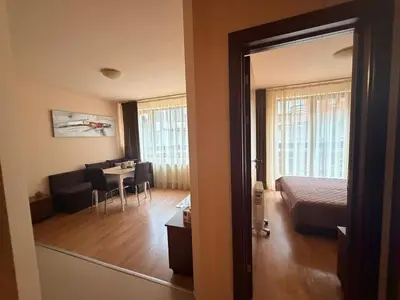 a room with a bedroom and a living room at Cozy One Bedroom Apartment in Bansko Near Gondola with Wi Fi in Bansko