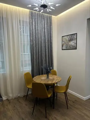 a dining room with a table and chairs at Kapana by V2 in Plovdiv