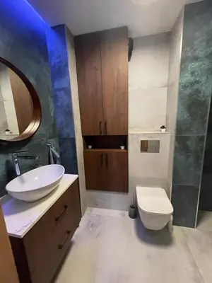 a bathroom with a sink and a toilet at Stylish Sofia Getaway 1BDR near Mall Sofia and metro station in Sofia