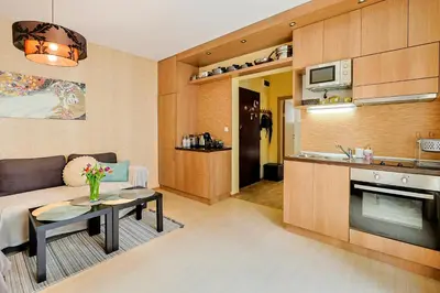 a living room with a couch and a table at TOP central location Sophia apt in Sofia