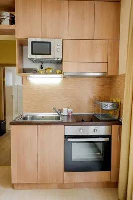 a kitchen with a sink and a microwave at TOP central location Sophia apt in Sofia