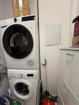 a washing machine and a washer in a kitchen at Modern 2 Bedroom - 2 Baths - Private Garage Free in Center in Sofia