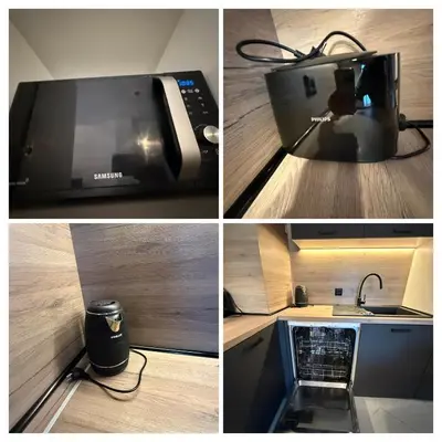 a microwave oven sitting on top of a kitchen counter at Modern 2 Bedroom - 2 Baths - Private Garage Free in Center in Sofia