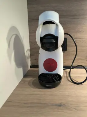 a white and red coffee maker sitting on a counter at Modern 2 Bedroom - 2 Baths - Private Garage Free in Center in Sofia