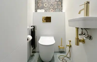 a bathroom with a white toilet and a sink at Charming Sofia Center Stay for 4 by Flat Mаnager in Sofia