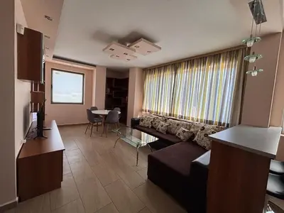 a living room with a couch and a table at Cozy 1-Bedroom Apartment Near Old Town - Purple5 in Plovdiv