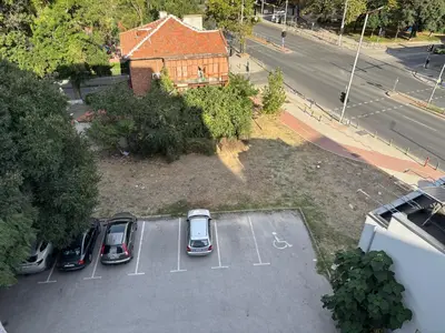 an aerial view of a parking lot with cars parked at Cozy 1-Bedroom Apartment Near Old Town - Purple5 in Plovdiv