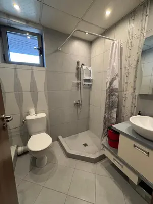 a bathroom with a toilet and a shower and a sink at Cozy 1-Bedroom Apartment Near Old Town - Purple5 in Plovdiv