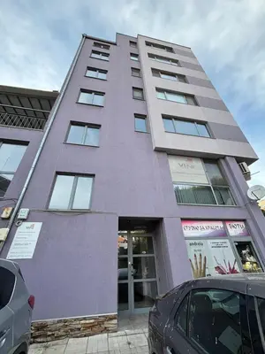 a purple building with cars parked in front of it at Cozy 1-Bedroom Apartment Near Old Town - Purple5 in Plovdiv