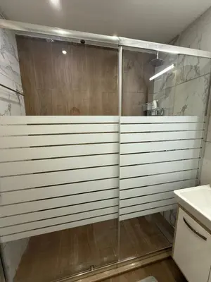 a shower with a glass door in a bathroom at Stylish studio E61 in Borovets Gardens in Borovets