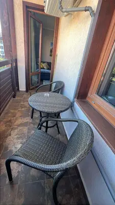 a patio with a table and a table and chair at The Bansko Retreat in Bansko