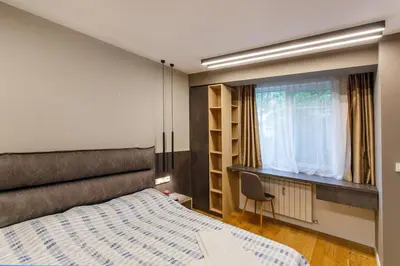 a bedroom with a large bed and a window at Apartment in Sofia's core - NDK in Sofia