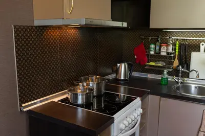 a kitchen with pots and pans on a stove at Megy's Top Central Studio Next to NDK in Sofia
