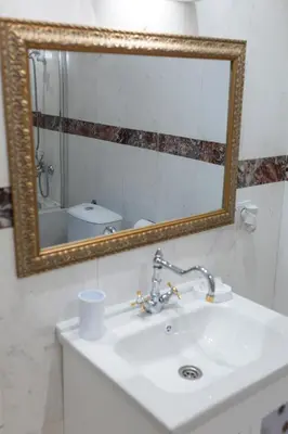 a bathroom with a sink and a mirror at Megy's Top Central Studio Next to NDK in Sofia