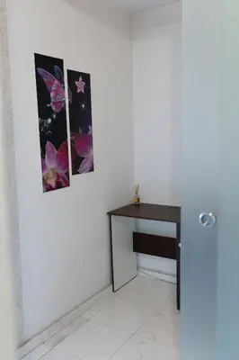 a room with a table and two pictures on the wall at Megy's 3rd Top Central Room in Sofia