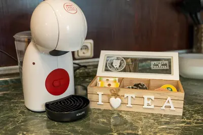 a mixer sitting on a counter next to a wooden box at Megy's 3rd Top Central Room in Sofia