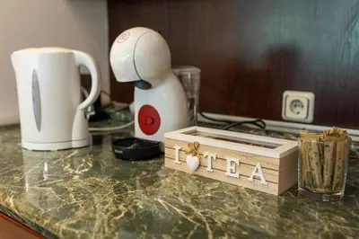 a counter top with a coffee maker and a box on it at Megy's 2nd Top Central Room in Sofia