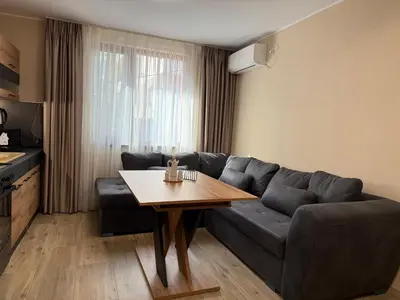 a living room with a couch and a table at Asen Tsvetkov Apartment in Sandanski