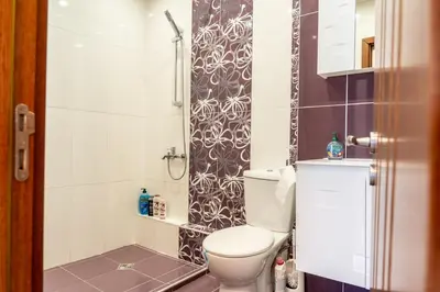 a bathroom with a toilet and a shower at Evgeny's Stylishly Designed 2 Bedroom Apartment plus Garage! in Sofia
