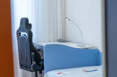 an office with a desk with a chair and a lamp at Evgeny's Stylishly Designed 2 Bedroom Apartment plus Garage! in Sofia