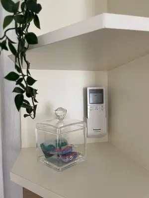 a fish bowl sitting on a counter with a tv at Well Equipped New Family Friendly One-Bedroom Flat in Sandanski