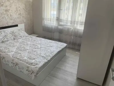 a bedroom with a bed and a window at 2 Bedroom apartment in Gotse Delchev