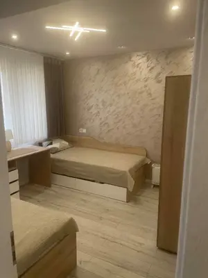 a small room with two beds and a sink at 2 Bedroom apartment in Gotse Delchev