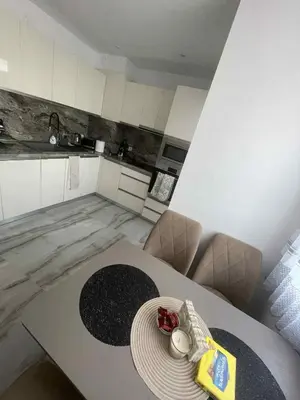 a kitchen with a table with a plate on it at 2 Bedroom apartment in Gotse Delchev