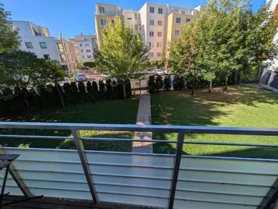 a view of a park from a balcony at Modern Apartment in Sofia Near City Center in Sofia