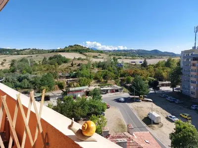 a view of a city from the balcony of a building at Strumsko Stay in Blagoevgrad