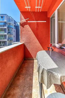 a small balcony with a table and a window at Comfort Corner - 1BD with Balcony by Flat Mаnager in Plovdiv