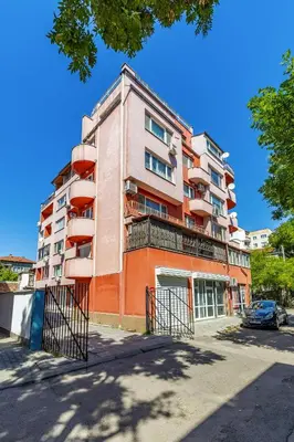 a tall apartment building with balconies on a street at Comfort Corner - 1BD with Balcony by Flat Mаnager in Plovdiv