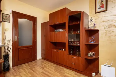 a large wooden cabinet in a room with a door at Comfort Corner - 1BD with Balcony by Flat Mаnager in Plovdiv