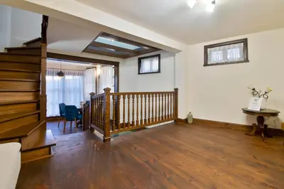 an empty living room with a wooden stair case at Blue House in Plovdiv