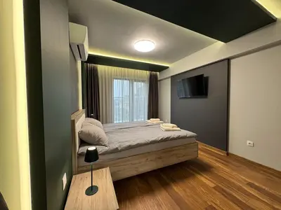 a small bedroom with a bed and a window at Dream Home A21 in Sofia